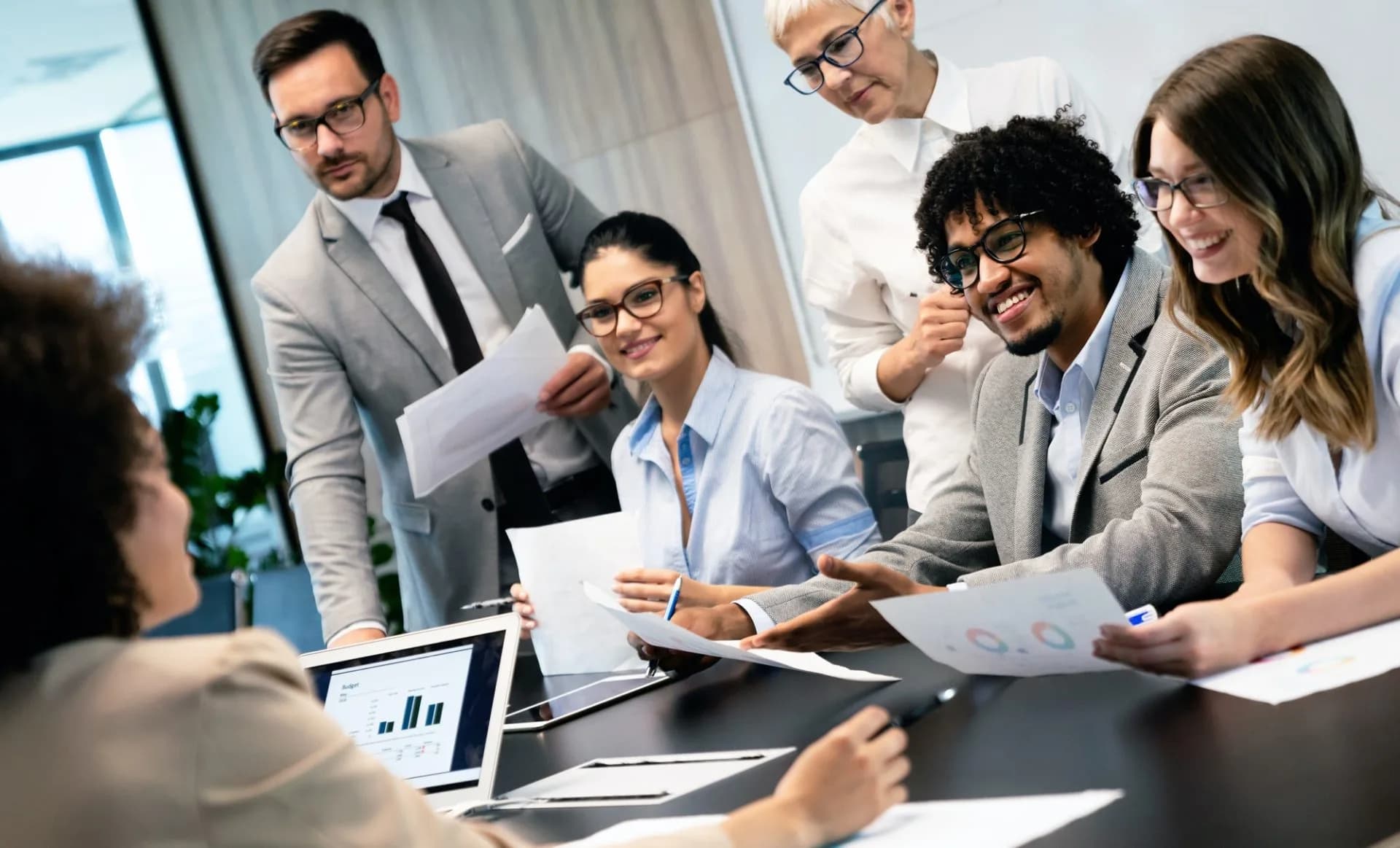 A diverse team of professionals collaborating in a modern office environment.
